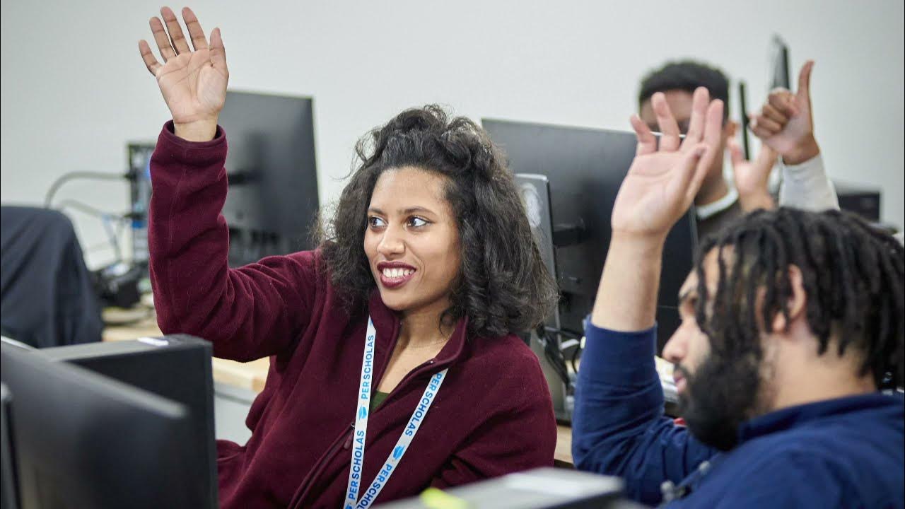 Adult students raising hands